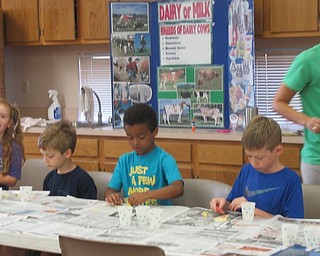 Neighbors | Jessica Harker.Children created sand art in the shape of pizzas on July 19 at the MetroParks Farm's Explorers Kitchen Chemists summer camp.