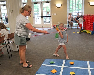 Neighbors | Jessica Harker .Children and their families played bean bag tic-tac-toe at the Poland library's annual Ice Cream Bash.