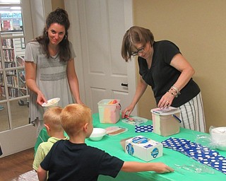 Neighbors | Jessica Harker .Poland librarians helped pass out ice cream to community members gathered at the library's annual Ice Cream Bash on Aug. 1.