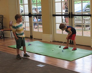 Neighbors | Jessica Harker .Children played indoor mini golf at the Poland library on Aug, 1 during the annual Ice Cream Bash.