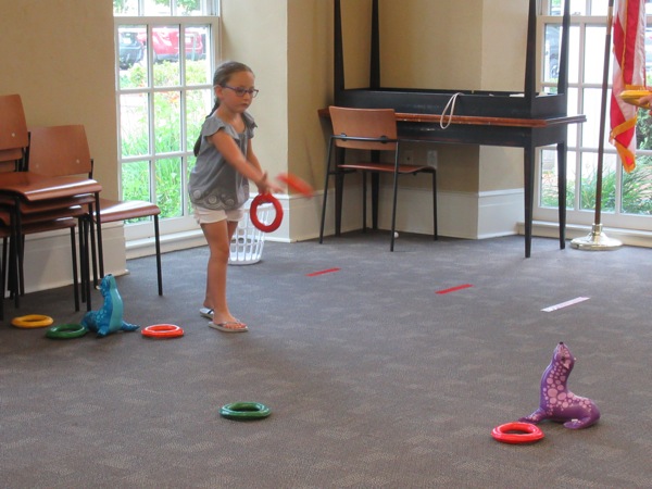 Neighbors | Jessica Harker .Children were able to play a game of ring toss at the Poland library's annual end of summer Ice Cream Bash on Aug. 1.