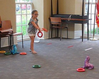 Neighbors | Jessica Harker .Children were able to play a game of ring toss at the Poland library's annual end of summer Ice Cream Bash on Aug. 1.