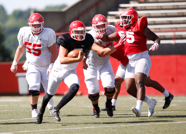 Quarterback Nathan Mays runs with the ball during YSU's scrimmage on Saturday. EMILY MATTHEWS | THE VINDICATOR