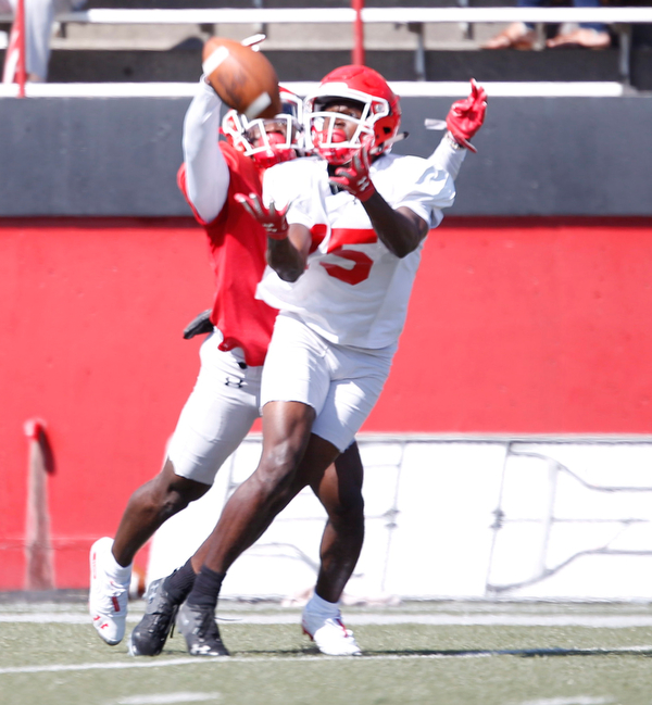 C.J. Charleston prepares to catch the ball as Dee Ford runs up behind him during YSU's scrimmage on Saturday. EMILY MATTHEWS | THE VINDICATOR