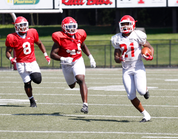 London Pearson runs with the ball to make a touchdown while Jaylen Hewlett (45) and Ray Anderson (8) chase him during YSU's scrimmage on Saturday. EMILY MATTHEWS | THE VINDICATOR