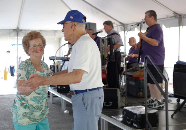 Pat Wagner and Joe Nemastil, both of Canton, dance while the Del Sinchak Band performs at the Slovak Fest at Byzantine Center at the Grove on Sunday afternoon. EMILY MATTHEWS | THE VINDICATOR
