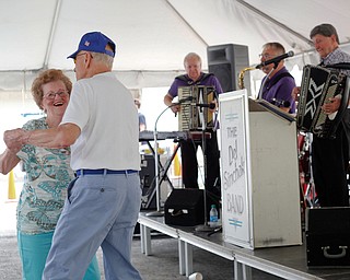 Pat Wagner and Joe Nemastil, both of Canton, dance while the Del Sinchak Band performs at the Slovak Fest at Byzantine Center at the Grove on Sunday afternoon. EMILY MATTHEWS | THE VINDICATOR