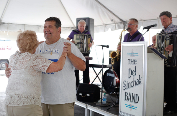 Rick Schen, of Canton, and Olga Spontak, of Zanesville, who recently celebrated her 90th birthday, dance while the Del Sinchak Band performs at the Slovak Fest at Byzantine Center at the Grove on Sunday afternoon. Schen and Spontak are friends who dance polka together. EMILY MATTHEWS | THE VINDICATOR