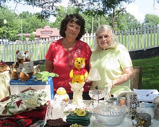 Neighbors | Jessica Harker .Alzheimer's Network boardmember Sandra Pope and Director Dorthy Barto ran a table at the yard sale run by Poland Sunrise July 25.