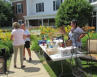 Neighbors | Jessica Harker .Poland Sunrise Senior Living employees hosted tables at the institutes Yard Sale July 25.