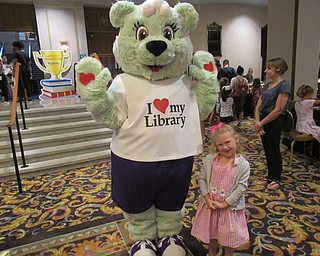 Neighbors | Jessica Harker .Avery Bacha posed with the library mascot on Aug. 2 during the Public Library of Youngstown and Mahoning County's annual Summer Reading Breakfast.