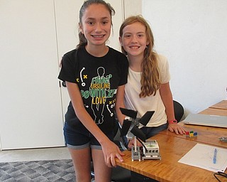 Neighbors | Jessica Harker .Josie Bichara and Joy Mohr built a windmill robot that responds to sensors at the Austintown library, as part of Tech Corp's Techie Camp.