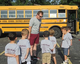 Neighbors | Jessica Harker .New Boardman Transportation Supervisor Ryan Dunn instructed a group of incoming kindergartners on proper bus safety at Boardman's annual Safety Village event on Aug. 7.
