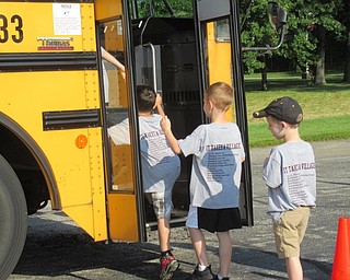 Neighbors | Jessica Harker .Incoming Boardman kindergartners practiced boarding the bus outside of Glenwood Junior High School during the districts annual Safety Village event on Aug. 7.