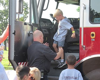 Neighbors | Jessica Harker .Boardman fire fighters allowed children to sit in a fire truck at Boardman's annual Safety Village event for incoming kindergartners on Aug. 7.