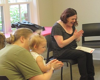 Neighbors | Jessica Harker .Librarian Amanda Kollar sang with children at Canfield's weekly Baby Brilliant event on Aug. 8.