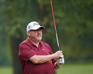 Chuck Burley watches his drive during the Greatest Golfer of the Valley tournament at Mill Creek Golf Course on Friday. EMILY MATTHEWS | THE VINDICATOR