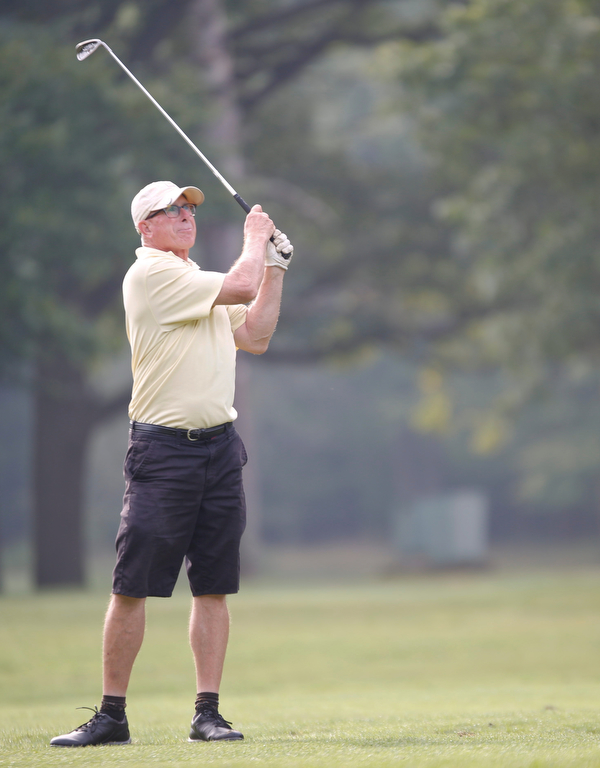 Rick Haldi watches his ball during the Greatest Golfer of the Valley tournament at Mill Creek Golf Course on Friday. EMILY MATTHEWS | THE VINDICATOR