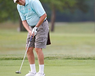 Robert Brown putts the ball during the Greatest Golfer of the Valley tournament at Mill Creek Golf Course on Friday. EMILY MATTHEWS | THE VINDICATOR