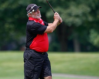 Leland Musguire watches his drive during the Farmers National Bank Greatest Golfer of the Valley tournament at Youngstown Country Club on Saturday. EMILY MATTHEWS | THE VINDICATOR