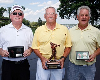 Legends Open Division first place finisher Robert Leonard, center, with a final score of 223, second place finisher Tim Porter, left, with a final score of 228, and third place finisher Ronald Daum, with a final score of 246. EMILY MATTHEWS | THE VINDICATOR