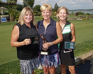 Women's Senior Net Division first place finisher Jean Scarsella, center, with a final score of 145, second place finisher Pam Porter, left, with a final score of 146, and third place finisher Linda Burke, with a final score of 150. EMILY MATTHEWS | THE VINDICATOR