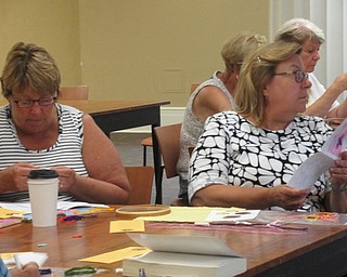 Neighbors | Jessica Harker.Community members worked on a funky flowers embroidery craft at the Poland library on Aug. 6.