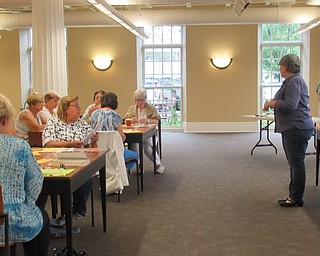 Neighbors | Jessica Harker.Julia Kerner, the Embroiderers' Guild's outreach chair member, insturcted community members on how to create the group's monthly craft at the Poland library August 6.