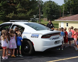 Neighbors | Abby Slanker.A member of the Canfield Police Department focused on teaching the children pedestrian and stranger safety at the PTA Kindergarten Safety Day on Aug. 17. The children were also able to check out the inside of a police cruiser.