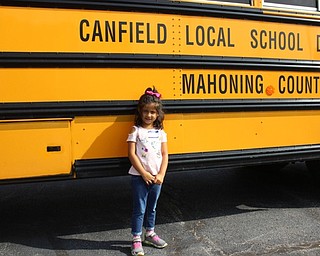 Neighbors | Abby Slanker.Selina Nepal, an incoming kindergartner at Hilltop Elementary School, prepared to visit her new school on her first bus ride during Canfield PTA's Kindergarten Safety Day.