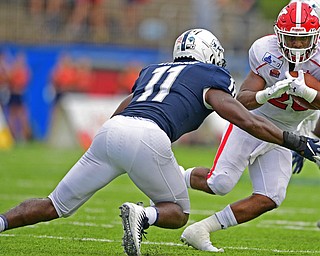 MONTGOMERY, ALABAMA - AUGUST 24, 2019: Youngstown State's Christian Turner runs the ball while before being hit by Will Hudson during the second half of their game, Saturday afternoon. DAVID DERMER | THE VINDICATOR