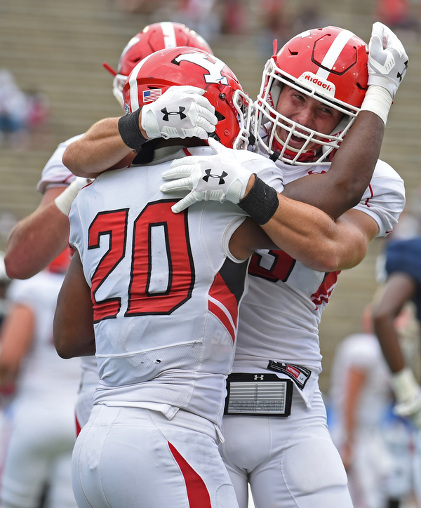 MONTGOMERY, ALABAMA - AUGUST 24, 2019: Youngstown State's Christian Turner is congratulated by Jake Cummings after scoring a touchdown during the second half of their game, Saturday afternoon. DAVID DERMER | THE VINDICATOR