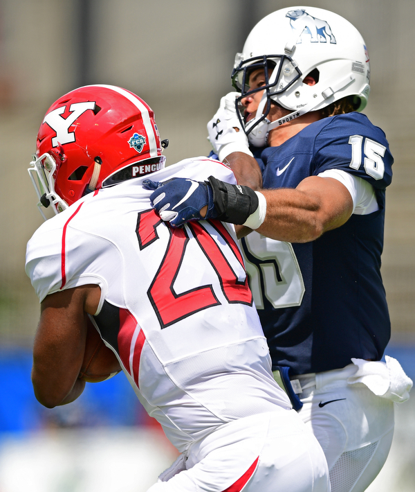 MONTGOMERY, ALABAMA - AUGUST 24, 2019: Youngstown State's Christian Turner stiff arms Samford's Ty Herring during the first half of their game, Saturday afternoon. DAVID DERMER | THE VINDICATOR