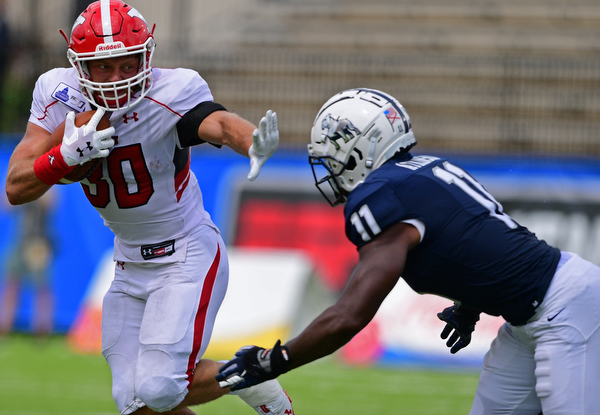 MONTGOMERY, ALABAMA - AUGUST 24, 2019: Youngstown State's Joe Alessi fights off Samford's Aaron Atkinson during the first half of their game, Saturday afternoon. DAVID DERMER | THE VINDICATOR