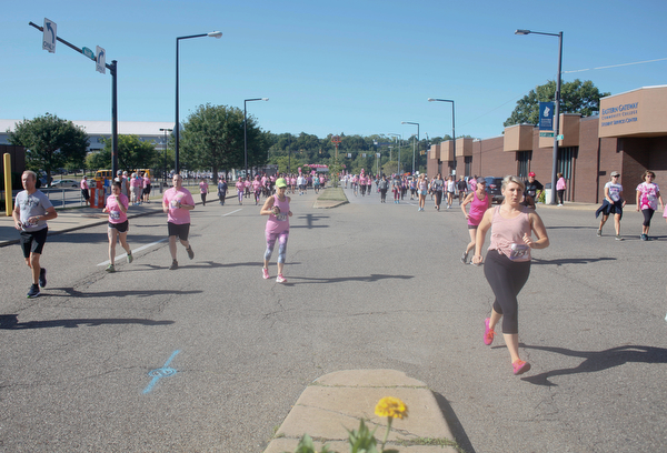 Runners and walkers make their way down Walnut Street during the 2019 Panerathon on Sunday morning. EMILY MATTHEWS | THE VINDICATOR