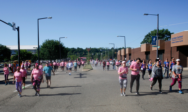 Runners and walkers make their way down Walnut Street during the 2019 Panerathon on Sunday morning. EMILY MATTHEWS | THE VINDICATOR