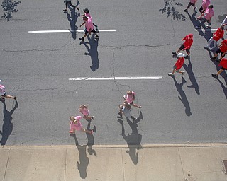 Runners and walkers make their way down Walnut Street during the 2019 Panerathon on Sunday morning. EMILY MATTHEWS | THE VINDICATOR