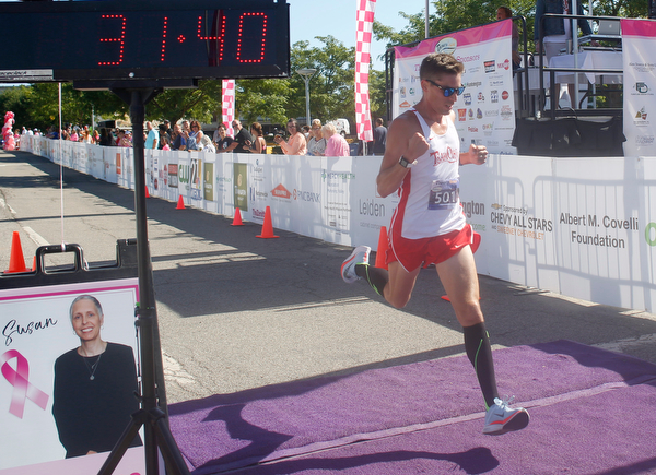 Andy Morgan, of Cortland, finishes the 10K in first place with a time of 31.40 during the 2019 Panerathon on Sunday morning. EMILY MATTHEWS | THE VINDICATOR
