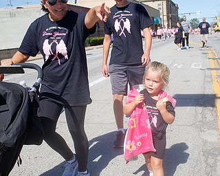From left, Jen Dimaiolo, Ethan Overly, and Remy Dimaiolo, all of whom were walking in memory of Donna Yancsurak, walk down Front Street as they near the finish of the two mile walk during the 2019 Panerathon on Sunday morning. EMILY MATTHEWS | THE VINDICATOR