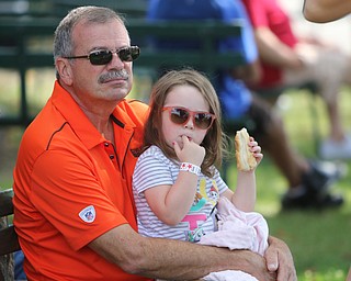  ROBERT K.YOSAY  | THE VINDICATOR..The 173rd version of the Canfield Fair opened Wednesday to mid 70 degrees, sun, and fries and sausage sandwiches...food glorious food as Madison Greenawalt 3.5 enjoys a hotdog with her mothers fiancee Burl Patton  mom is Renee Greenawalt all of canfield