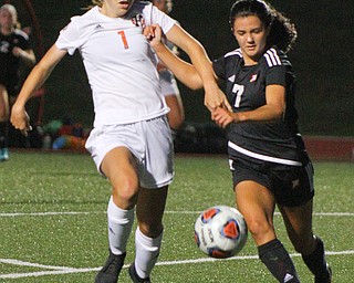 William D. Lewis The Vindicaor  Howland's Rylie Daniluk, 1, left, and Mooney's Gia Diorio(7) go for the ball during 8-28-19 action at YSU.