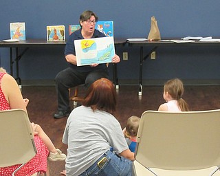 Neighbors | Jessica Harker.Librarian Karen Saunders read to children gathered at the Boardman library August 7 for the groups Family Story Time event.