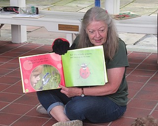 Neighbors | Jessica Harker .Naturalist Marilyn Williams read books about ladybugs to children gathered at the park's monthly Tales for Tots event.
