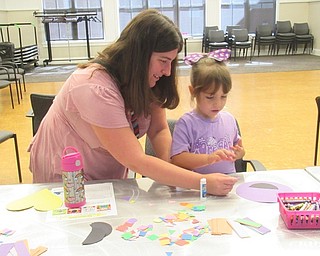 Neighbors | Jessica Harker .Children used different cut out shapes to create a monster at the Read and Make event at the Canfield library on Aug. 31.
