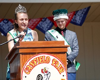 Callia Barwick, left, last year's 4-H queen, and Matthew Fetty, last year's 4-H king, speak before the crowning of this year's king and queen during the Mahoning County Junior Fair Youth Day Ceremony on Thursday. EMILY MATTHEWS | THE VINDICATOR