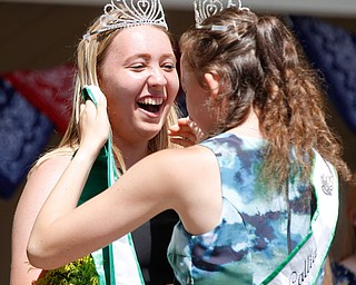 Callia Barwick, right, last year's 4-H queen, crowns Natalia Kresic this year's 4-H queen during the Mahoning County Junior Fair Youth Day Ceremony on Thursday. EMILY MATTHEWS | THE VINDICATOR