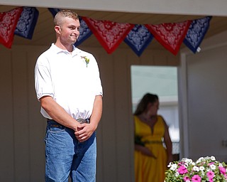 Thomas Kemp, of West Branch, stands on stage before the crowning this year's Outstanding Youth during the Mahoning County Junior Fair Youth Day Ceremony on Thursday. Kemp was crowned this year's male Outstanding Youth. EMILY MATTHEWS | THE VINDICATOR
