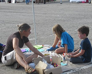 Neighbors | Jessica Harker .Children created free crafts at the Kids Corner tent at the weekly Austintown Farmers Market August 19 at Austintown Township Park.