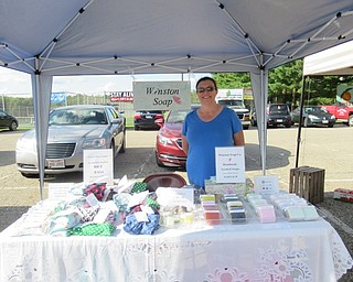 Neighbors | Jessica Harker .The Winston Soap Company, of Austintown, run by Elsie Wood, set up a stand selling handmade soap salt scrubs and other items at the Austintown Farmers Market August 19.