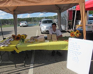 Neighbors | Jessica Harker .James Natural Products had a stand at the Austintown Farmers Market August 19, selling baked goods, honey products, canned goods and fresh seasonal fruit.